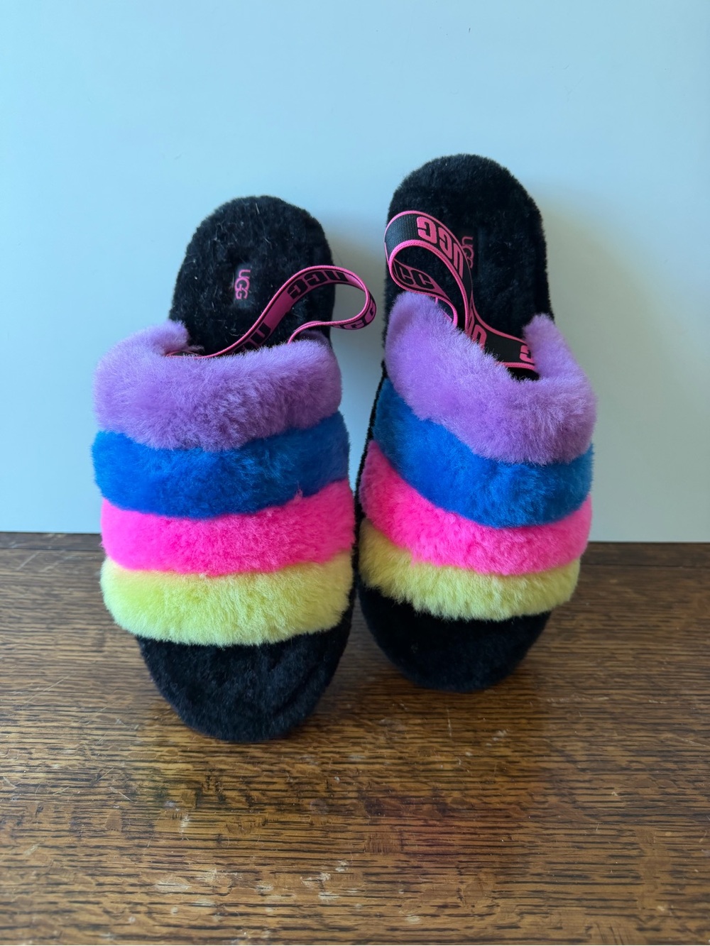 UGG Rainbow Shearling Slides in Black with Purple, Blue, Pink and Yellow Stripes